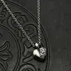 Collar Colgante de Corazón Roto y Lápida de Plata Tailandesa Retro Tendencia Estilo Nicho Europeo y Americano Alto Gama Otoño e Invierno
