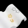 Pendientes de comercio electrónico transfronterizo para ojos de luna pendientes de circonita de ocho puntas joyería de moda exquisita para piercing al por mayor