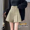 Shorts de pana para mujer, nuevo estilo otoño/invierno, de doble botonadura, corte holgado, diseñados para usarse sobre otros pantalones, efecto adelgazante, disponibles en negro y caqui