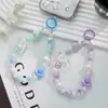 Funda para teléfono móvil color macaron con cordón estilo japonés-coreano Ins hecho a mano con cuentas de flores cadena para teléfono móvil de muñeca lazo