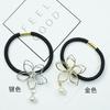 A023 hermoso amor moda boutique estrella pequeña flor alambre hueco anillo para el cabello pedrería perla simple y generoso