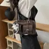 Bolso de mujer único de nicho estilo coreano, nuevo modelo primavera 2026, exquisito y elegante, bolso de hombro y bandolera simple y casual