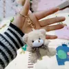 Lindo oso de peluche con pajarita, colgante, nuevo osito de peluche, llavero, muñeca, adornos para mochila