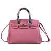 Bolso de mano transfronterizo de lujo ligero, bolso cruzado para mujer, modelo nuevo con cierre, bolso de hombro versátil, patrón de lichi, bolso de alta gama para el día a día
