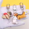 Lindo llavero colgante de cachorro de mascota de dibujos animados, colgante de perro creativo, pequeño regalo para estudiantes y parejas, decoración de perro