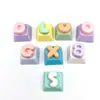 Teclado de letra de macarrón para aliviar el estrés Teclado DIY Llavero de juguete para aliviar el estrés