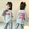 Top de punto gofre estilo coreano, imitación de dos piezas, manga larga para niñas, nuevo estilo primavera/otoño para niños medianos y grandes, versátil, elegante, capa base holgada