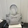 Nueva bolsa de tela de color liso transfronteriza 2026 principios de otoño elegante de gran capacidad de alto valor texturizada versátil bolso de hombro cruzado