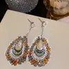 Pendientes Redondos Plegados con Borlas Tachonados de Pedrería Estilo Retro Europeo y Americano, de Moda y Versátiles, con un Toque de Lujo Ligero y de Alta Gama