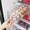Caixa de armazenamento de geladeira empilhável nova transfronteiriça cozinha armazenamento com tampa 14 compartimentos alça embutida caixa de ovos fabricante