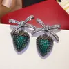 Pendientes de mariposa y flor de circón verde ultrabrillante transfronterizos, sensación de lujo ligero de alta gama, pendientes versátiles con un diseño único