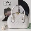 Popular bolsa de concha 2026, nuevo bolso de hombro de moda, bolso de mujer para el trabajo, bolso floral de bordado de hueso para teléfono móvil, bolso cruzado para mujer