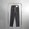 Pantalones casuales de tela seersucker para hombre, transpirables, ligeros, para primavera/verano, con rayas verticales 11789