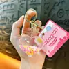 Llavero creativo nuevo de aceite amoroso lindo de arena movediza líquida pequeño colgante accesorios para bolso pequeños regalos al por mayor