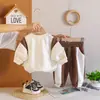 Conjunto Masculino Primavera e Outono 2026 Novo Estiloso Roupas de Outono para Bebê Moletom de Manga Longa Conjunto de Duas Peças Roupa para Bebês e Crianças Venda por Atacado