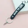 6051 # Chaveiro de PVC Macio Corda de Couro Corrente de Quatro Seções Verso em Inglês Acessórios de Cordão Versáteis