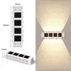 Lámpara solar de jardín para exteriores, lámpara de pared para el hogar, diseño decorativo, valla, pared, nuevo estilo, lámpara de pared con ambiente luminoso de arriba a abajo.