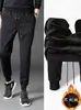 Calça masculina para esportes de inverno transfronteiriça, roupa de trabalho juvenil, calça casual estudantil com forro de fleece, tendência versátil para outono e inverno
