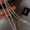Accesorios de collar de perlas pequeñas Shijia para mujer, cadena de clavícula de cuentas de verano, cadena para el cuello de lujo ligero de nicho de alta gama