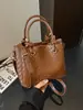 Bolso de mano tejido de otoño transfronterizo para mujer 2026 nuevo diseño de moda bolso de hombro simple bolso cruzado de nicho para el día a día
