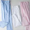 Pantalones de enfermera de hospital al por mayor, pantalones de traje de cintura elástica blancos de primavera y otoño, ropa de médico, ropa de enfermera, sombrero, pantalones de trabajo