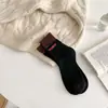 Calcetines gruesos con forro de felpa de tubo cálidos para mujer, calcetines populares retro versátiles para pareja, calcetines de rizo con letras para hombre y mujer