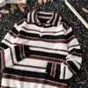 Suéter a rayas estilo americano 2026 nuevo para hombre, otoño e invierno moderno retro holgado versátil colorblock para pareja cuello vuelto tejido