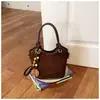 Bolsa feminina de nicho requintada e moderna, novo modelo 2026, bolsa de ombro única e transversal, bolsa de mão estilo balde retrô fashion
