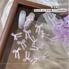 Accesorios de moño para decoración de uñas transparentes tallados suavemente, populares en Xiaohongshu, decoraciones de moño de cinta impresas esmeriladas para uñas