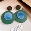 Pendientes de botón redondos con flor de resina y pasador de plata vintage europeo y americano, pendientes simples y elegantes, pendientes de nicho de alta gama para mujer