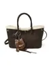 Bolso de mano casual de moda con personalidad, diseño de nicho, bolso de hombro cruzado texturizado, bolso de mujer de moda para el invierno 2026