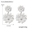 Europa y Estados Unidos venta caliente transfronteriza talla anillo aretes de flor hueca acero titanio chapado oro 18K aretes exagerados joyería mujer