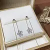 Aguja de plata S925 tiembla con un pendiente de borla de flor de temperamento dulce multi-uso Línea de oreja versátil de lujo ligero para mujer