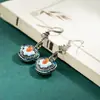 Transmisión en vivo artesanía personalizada de epoxy aretes Ruyi aretes retro de estilo étnico largo aretes simples de temperamento para mujer