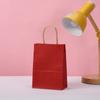 Bolsa de regalo de papel Kraft de color sólido multi-especificación bolsa de dulces al por mayor simple rojo grande color sólido bolso de mano al por mayor