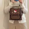 Mochila nicho fresco caricatura 2026 mochila para ir al trabajo nuevo estilo femenina lindo estilo pequeño versión coreana escolar estampado de leopardo moda