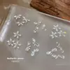 Mariposa Zircón Montón Diamante Arte de Uñas Joyería Producto Terminado Blanco Flor de Cinco Pétalos Brillante Pajarita Diamante para Uñas Accesorios Portátiles Venta al por Mayor