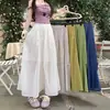 Toma Real de Falda de Algodón y Lino Transparente con Pliegues Diseño Verano 2026 Color Verde Fruta Festivo de Longitud Media con Corte Amplio en A