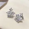 Versa Nuevos Pendientes Elegantes Pequeños y Exquisitos Corona Azul Tansan Chapados en Oro Pendientes de Lujo Ligero Esmeralda Seiko
