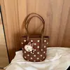 Bolso de mano casual transfronterizo para el día a día, bolso de hombro de lunares de nicho, nuevo bolso tipo cubo de gran capacidad otoño 2026