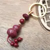Colgante Llavero de Cinabrio de Alto Contenido Loto de Cinabrio Pixiu Llavero Arena Dorada Morada Colgante para Cadena de Bolso de Teléfono Móvil de Buena Suerte
