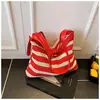 Bolso de Hombro Nicho Nuevo Transfronterizo 2025 Moda de Alta Gama Rayado de Mano Cruzado para Desplazamiento Versátil Bolso Tote