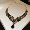 Traje de collar y pendientes de diamante ovalado europeo y americano exagerado luz de lujo alta gama cadena de clavícula nicho moda joyería al por mayor