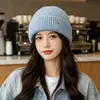 Nuevo sombrero de estilo coreano para mujer con circunferencia de cabeza grande, nuevo sombrero cálido de punto de lana para exteriores para otoño e invierno 2026, que protege los oídos.