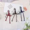 Nudo de Corazón Creativo Nuevo Estilo Miu Lanyard Versátil Llavero Colgante para Bolsas y Fundas de Teléfono