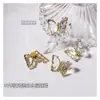 Artistas de uñas de moda joyería de circonita flor giratoria molino de viento tridimensional súper brillante cristal de circonita mariposa decoración de uñas fabricantes
