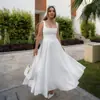 Comercio exterior transfronterizo 2025 primavera y verano nuevo europeo y americano mujer elegante color liso cuello cuadrado sin mangas correa en la cintura vestido mujer