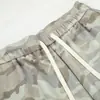 Pantalones casuales de camuflaje para hombre, pantalones deportivos holgados de pierna ancha estilo americano de moda con cordón y cintura elástica, pantalones deportivos versátiles