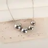 Transfronterizo nuevo de gran venta personalizado moda cobre oro y plata colgante de cuenta redonda cadena de labios Joker personalizada collar al por mayor