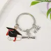 Temporada de formatura chapéu de bacharel tag de flor de livro chaveiro estudante exame de admissão à faculdade presente comemorativo pingente de bolsa criativo